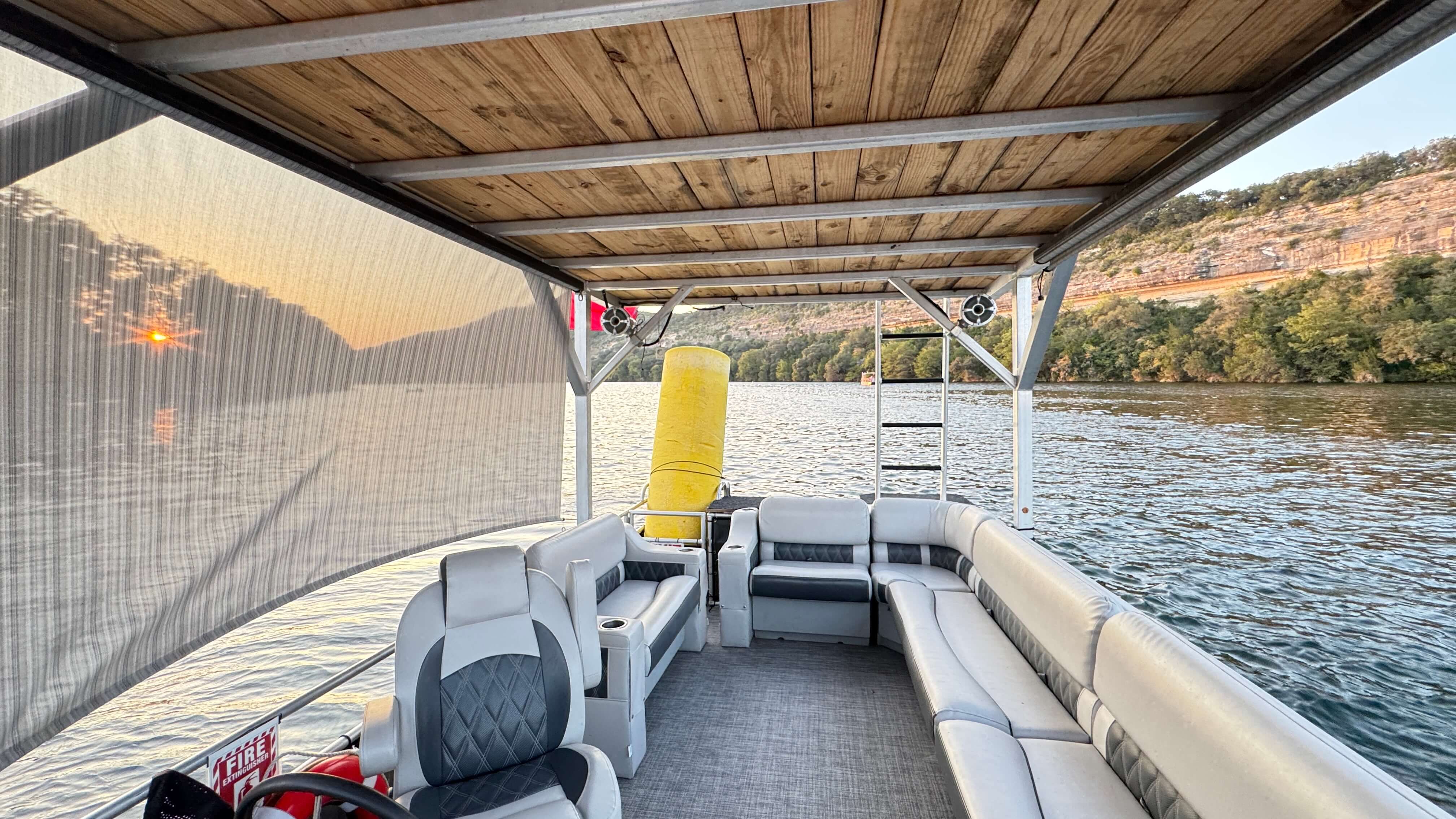 Group of friends enjoying pontoon boat ride