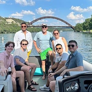 Bachelor party group enjoying boat rental on Lake Travis with 360 Bridge